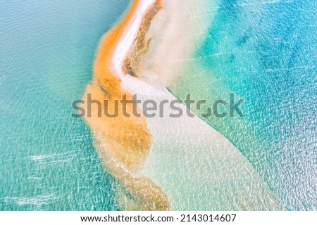 Meeting of two seas, Kinburn Spit, Ukraine, amazing aerial view. The border of the blue Black Sea and the Dnieper river, wild nature, beautiful landscape, in bright sunny weather.