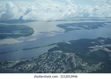 The Meeting Of Waters Is The Confluence Between The Rio Negro, A River With Dark (almost Black Coloured) Water, And The Sandy-coloured Amazon River Or Rio Solimões. 