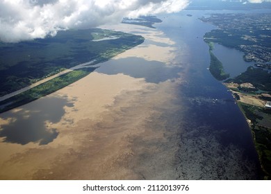 The Meeting Of Waters Is The Confluence Between The Rio Negro, A River With Dark (almost Black Coloured) Water, And The Sandy-coloured Amazon River Or Rio Solimões. 