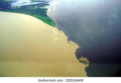 The Meeting Of Waters Is The Confluence Between The Rio Negro, A River With Dark (almost Black Coloured) Water, And The Sandy-coloured Amazon River Or Rio Solimões. 