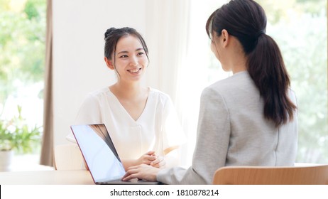 Meeting young asian women in the room. Consultant. - Powered by Shutterstock