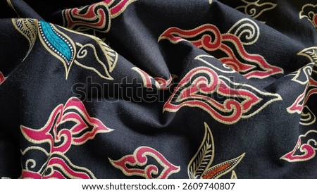 Mega Mendung batik motif with cloud ornament patterns on a black background