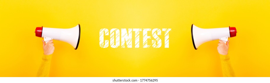 megaphones and inscription contest on yellow background, panoramic image