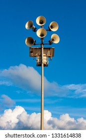MEGAPHONES ON THE BEACH ON THE BACKGROUND OF HEAVEN AND CLOUDS