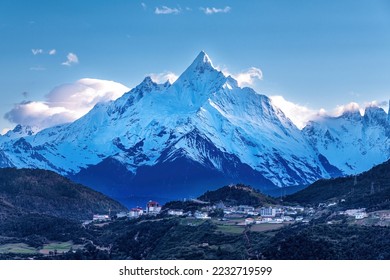 Meili Snow Mountain and town landscape in Deqen prefecture Yunnan province, China.	
 - Powered by Shutterstock