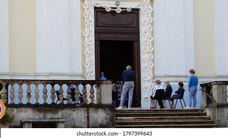 
Meina Italy Aug16 2020 - Some People Follow The Religious Service Outside The Church Due To Covid-19