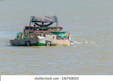 Mekong Delta / Vietnam - March 04 2019: A Dredge Boat With Sand Travels Down The Mekong River Near Ho Chi Minh City.