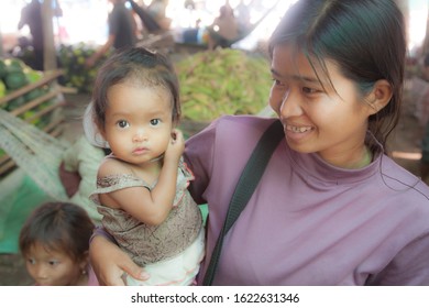 Mekong River, 2/28/2011: Portrait of a Cambodian mother and her infant child