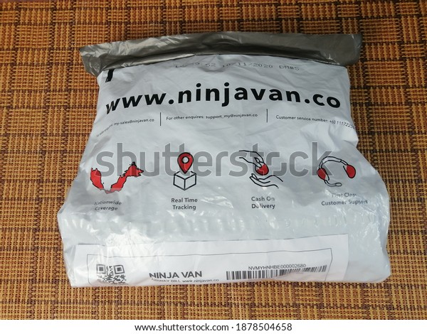 Melaka, Malaysia. 19th Dec 2020:\
Packaging\
delivered by Ninja Van on the table. It’s a tech-enabled express\
logistics company providing hassle-free delivery services for\
businesses of all\
sizes.
