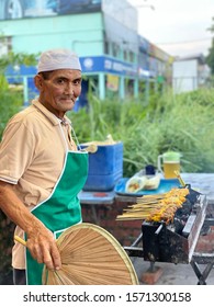 Melaka, Malaysia- Circa November 2019; A Malay Man Char Grilling  Chicken Satay At His Hawker's Stall. Satay Is A Popular Dish In Malaysia. Originated From Indonesia.