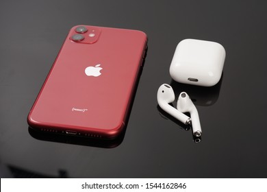 Melaka, Malaysia - Circa October, 2019: The All New IPhone 11 Product Red With Air Pods / Airpods