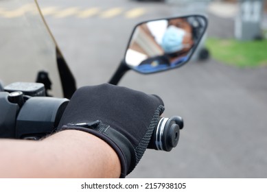 Melaka. Malaysia. May 2022. Man With Motorcycle Handle Bar.  