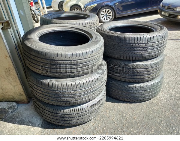 MELAKA,\
MALAYSIA -MAY 5, 2022: The new tire tread. It was designed to\
provide grip to vehicles and road surfaces to ensure user safety.\
Have a quality level that needs to be adhered\
to.