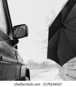 Melancholic Autumn Background With An Umbrella And A Car In The Rain.no People.black And White Photo.