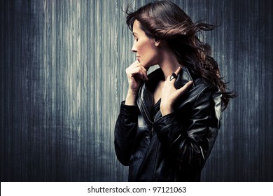 Melancholy Adult Woman In Black Leather  Jacket Profile Portrait