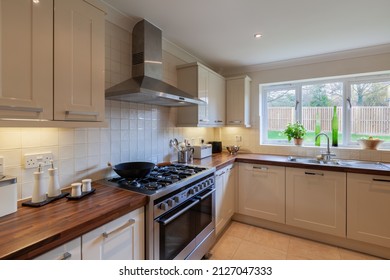 Melbourn, Cambridgeshire - March 26 2011: Luxury Modern Fitted Kitchen Within New Home Staged For Sale With Twin Oven Stainless Steel Range