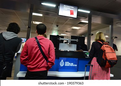 MELBOURNE - APR 15 2014:Passengers at Australian Customs and Border Protection checkpoint in Melbourne airport.The agency responsible for the safety, security and commercial interests of Australians
