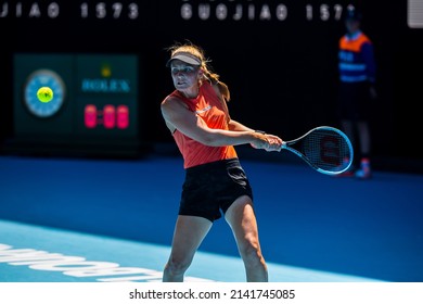MELBOURNE, AUSTRALIA - 19 JANUARY, 2022: Australian Open Tennis Grand Slam. Day 3, Kaia Kanepi (EST) won against Maddison Inglis (AUS). 2:6, 6:2, 6:0. Inglis swings for a powerful backhand. 