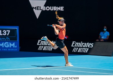 MELBOURNE, AUSTRALIA - 19 JANUARY, 2022: Australian Open Tennis Grand Slam. Day 3, Kaia Kanepi (EST) won against Maddison Inglis (AUS). 2:6, 6:2, 6:0. Inglis landing a leap after a return shot. 