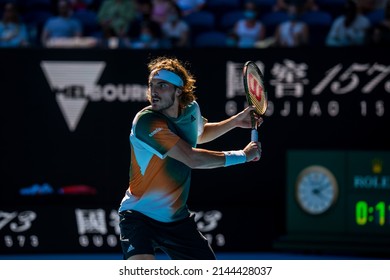 MELBOURNE, AUSTRALIA - 19 JANUARY, 2022: Australian Open Tennis Grand Slam. Day 3, Stefanos Tsitsipas (GRE) won against Benoit Paire (FRA). 6:3, 7:5, 6:7, 6:4. Tsitsipas with a racquet