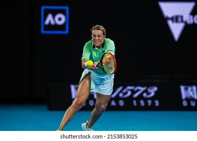 MELBOURNE, AUSTRALIA - 22 JANUARY, 2022: Australian Open Tennis Grand Slam. Day 6, Sorana Cirstea (ROM) won against Anastasia Pavlyuchenkova (RUS) 6:3, 2:6, 6:2 Pavlyuchenkova reaching for the ball.