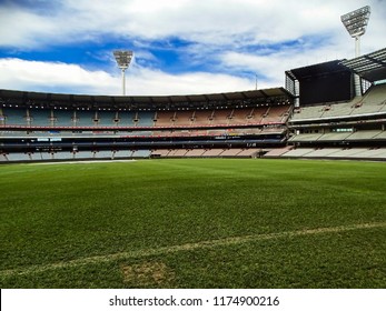 Melbourne, Australia - 7th September, 2017: View Of The Colossal Stands, Tall Floodlights And The Lush Green Grassy Field Of The Melbourne Cricket Ground (MCG)