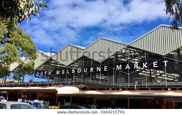 Melbourne,\
Australia: April 06, 2018: Street view of South Melbourne Market\
which opened in 1867. The multifaceted rooftop car park captures\
rainwater and generates solar\
energy.