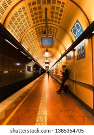 Melbourne, Australia - April 15, 2019: A Man Leaning On The Wall Waiting For Train At Flagstaff Station.