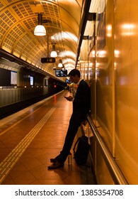 Melbourne, Australia - April 15, 2019: A Man Leaning On The Wall Waiting For Train At Flagstaff Station.