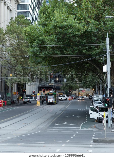 Melbourne, Australia - April 17, 2019: Tram beneath\
the tree at Market St,\
CBD.