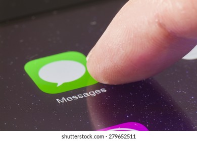 Melbourne, Australia - April 22, 2015: Macro Image Of Clicking The Messages Icon On An IPad Screen. Messages Is An Instant Messaging App Developed By Apple Inc. For IOS Systems.