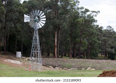 Melbourne, Australia - April 29, 2022:  New Southern Cross Windmill in a farm field in Pakenham rural Victoria, Australia.