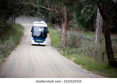 Melbourne, Australia - April 29, 2022:  A School Bus On The Road Driving Through Tynong North, West Gippsland, Taking The Kids Home From School.