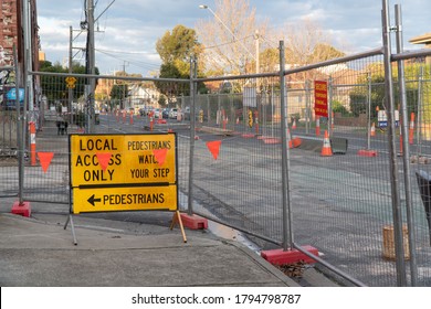 Melbourne, Australia - August 2, 2020: Traffic Management And Road Works Signs With Temporary Fencing On A Street In Melbourne