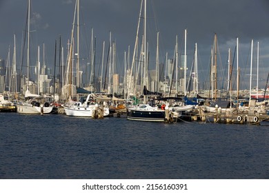 Melbourne, Australia - December 10, 2021:  Yachts Moored At Hobsons Bay Williamstown, Melbourne, Victoria At Sunset On A Warm Summers Evening With The Skyline Of Melbourne In The Distance.