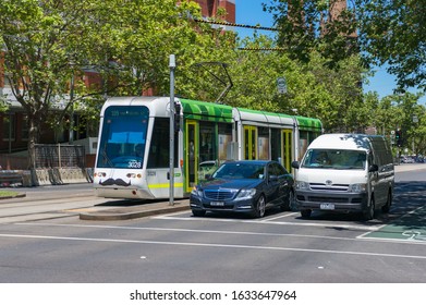 Melbourne, Australia - December 7, 2016: Modern Tramway And Cars On Road Crossing In Melbourne. Public Transport Victoria 
