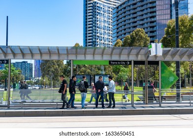 Melbourne, Australia - December 7, 2016: People Waiting On Tramway Station To Melbourne CBD. MElbourne Public Transport Infrastructure 