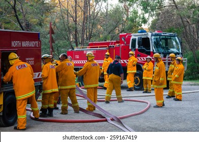 MELBOURNE, AUSTRALIA - February 10, 2015: Volunteer Fire Fighters From The North Warrandyte Brigade Of The Country Fire Authority Practicing By The Yarra River In Warrandyte, With Isuzu Fire Trucks.