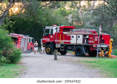 MELBOURNE, AUSTRALIA - February 10, 2015: Volunteer Fire Fighters From The North Warrandyte Brigade Of The Country Fire Authority Practicing By The Yarra River In Warrandyte, With Isuzu Fire Trucks.