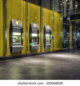 Melbourne, Australia - February 19, 2012: A Row Of Three Commonwealth Bank Automatic Teller Machines In The CBD At Night. The Commonwealth Bank Is The Largest Of The 