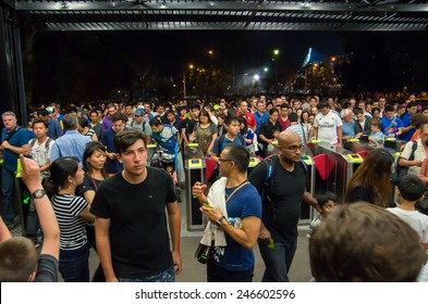 MELBOURNE, AUSTRALIA - January 20, 2015: People Queuing To Enter Richmond Train Station After The End Of An AFC Asian Cup Soccer Match At The Nearby Melbourne Rectangular Stadium