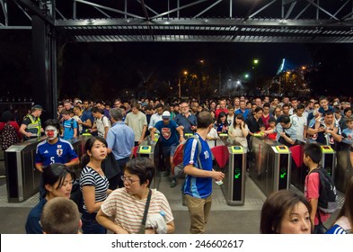 MELBOURNE, AUSTRALIA - January 20, 2015: People Queuing To Enter Richmond Train Station After The End Of An AFC Asian Cup Soccer Match At The Nearby Melbourne Rectangular Stadium