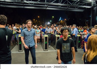 MELBOURNE, AUSTRALIA - January 20, 2015: People Queuing To Enter Richmond Train Station After The End Of An AFC Asian Cup Soccer Match At The Nearby Melbourne Rectangular Stadium