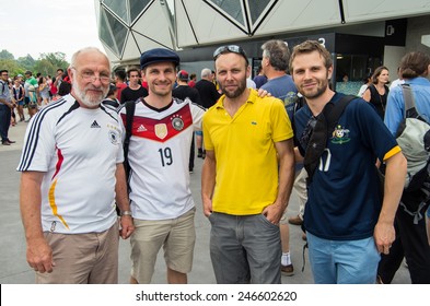 MELBOURNE, AUSTRALIA - January 22, 2015: German And Australian (Socceroos) Football Fans In National Shirts Outside The Melbourne Rectangular Stadium Before An AFC Asian Cup Match.