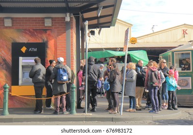 MELBOURNE AUSTRALIA - JULY 2, 2017: Unidentified people queue for ATM in Melbourne.