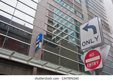 MELBOURNE, AUSTRALIA - JULY 30, 2018: Arrow Sign To Only Turn Left To Parking Building And No Entry Sign