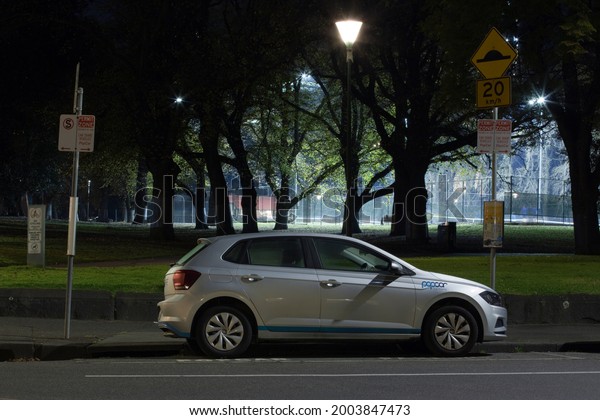 Melbourne,\
Australia - June 21, 2021: \
 Night image of a car-sharing car\
parked in a dedicated parking, pick-up location.  A convenient way\
to rent a car for locals and tourists. \
