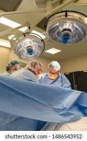 Melbourne, Australia - June 7, 2019: Surgeons Performing A Caesarean Section In An Operating Theatre In The Royal Women's Hospital.