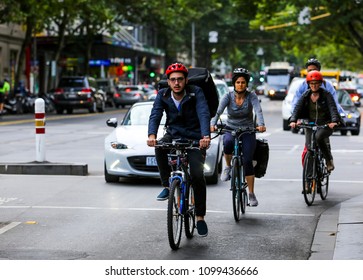 MELBOURNE, AUSTRALIA - MARCH 15, 2018 : Cyclist At Melbourne City Center. People Using Bicycle For Commute To Work Or Food Delivery.