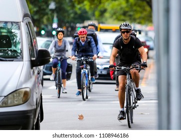 MELBOURNE, AUSTRALIA - MARCH 15, 2018 : Cyclist At Melbourne City Center. People Using Bicycle For Commute To Work Or Food Delivery.